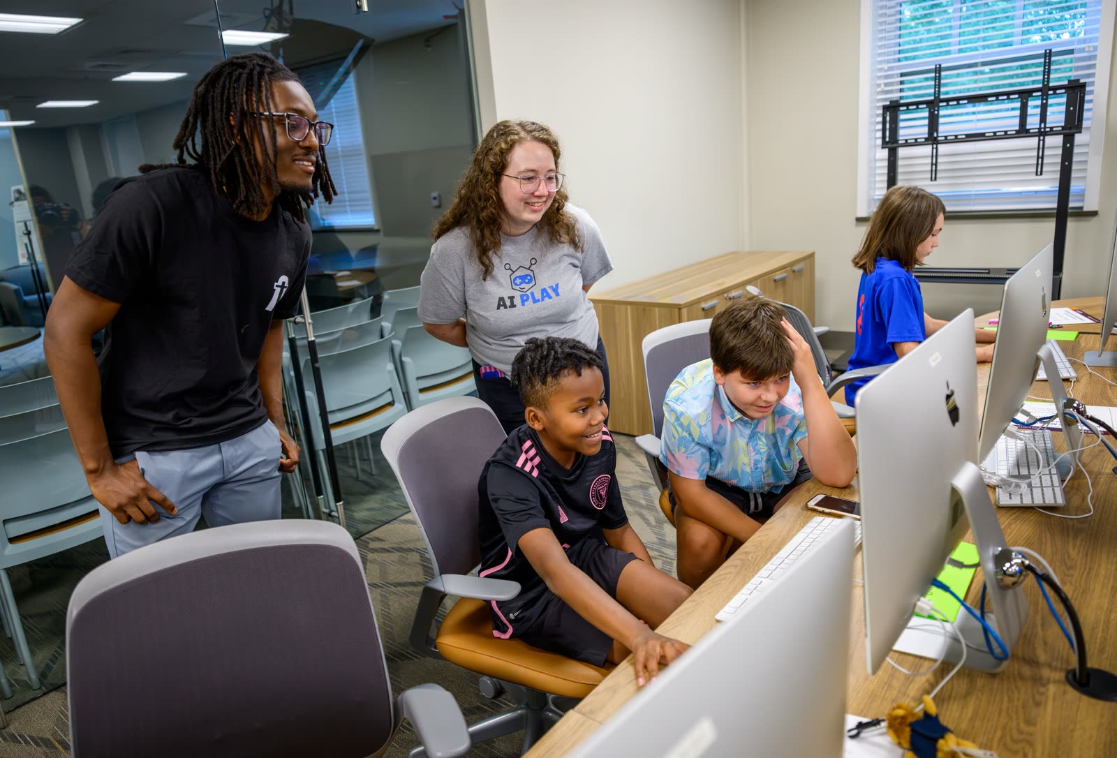 Coaches helping campers build their first AI agents